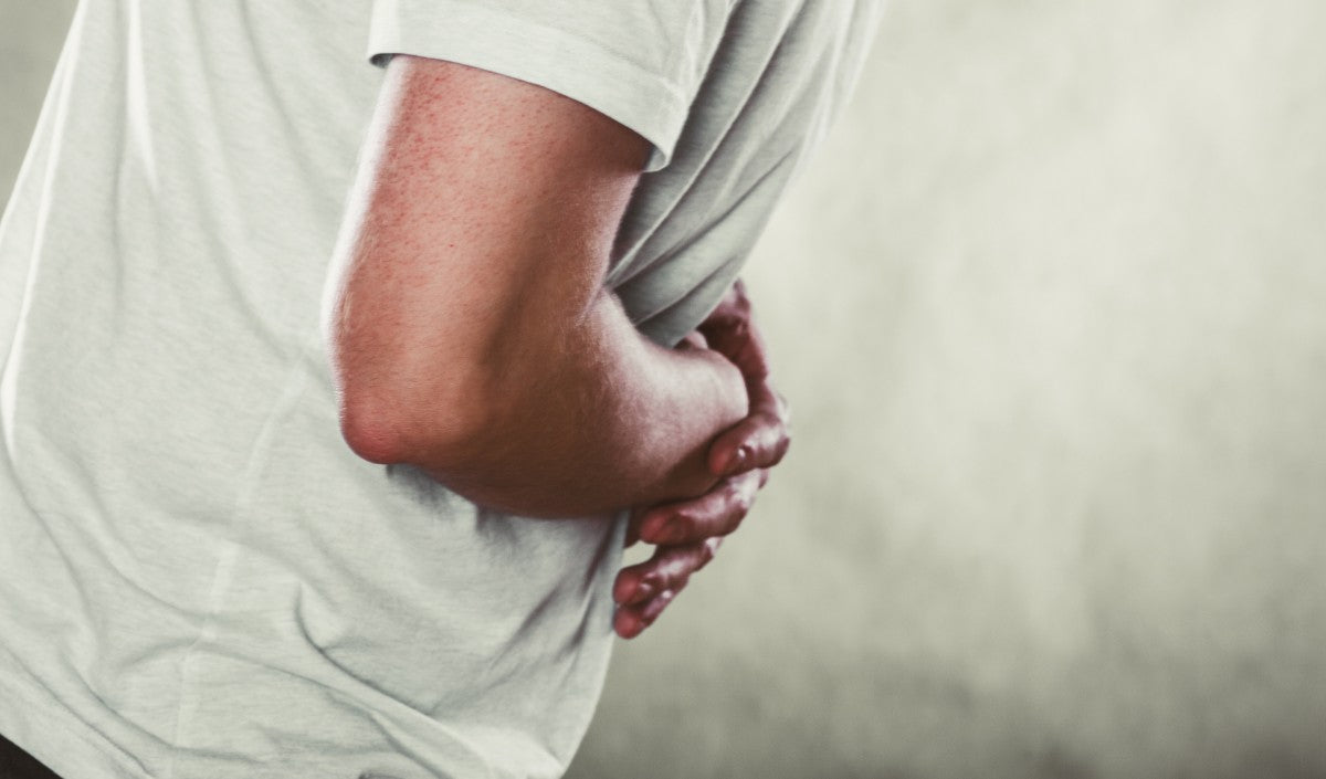 Man suffering from stomach ache abdominal pain to illustrate can a gastric sleeve stretch