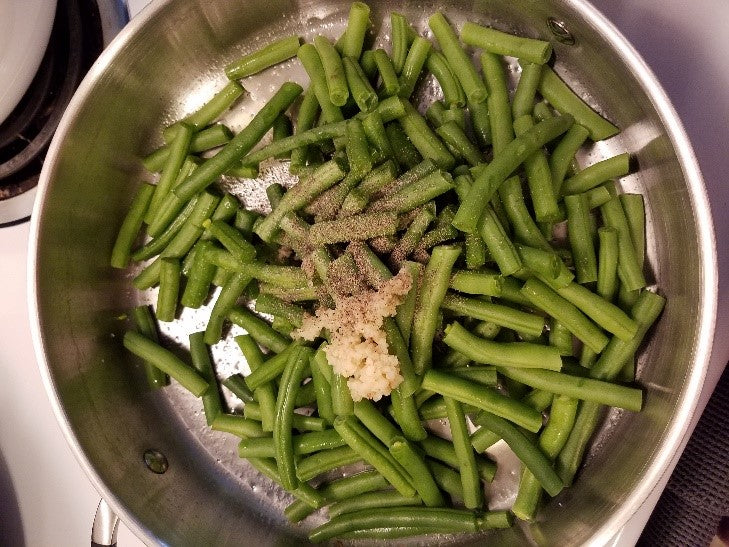 green beans cooking in a pan
